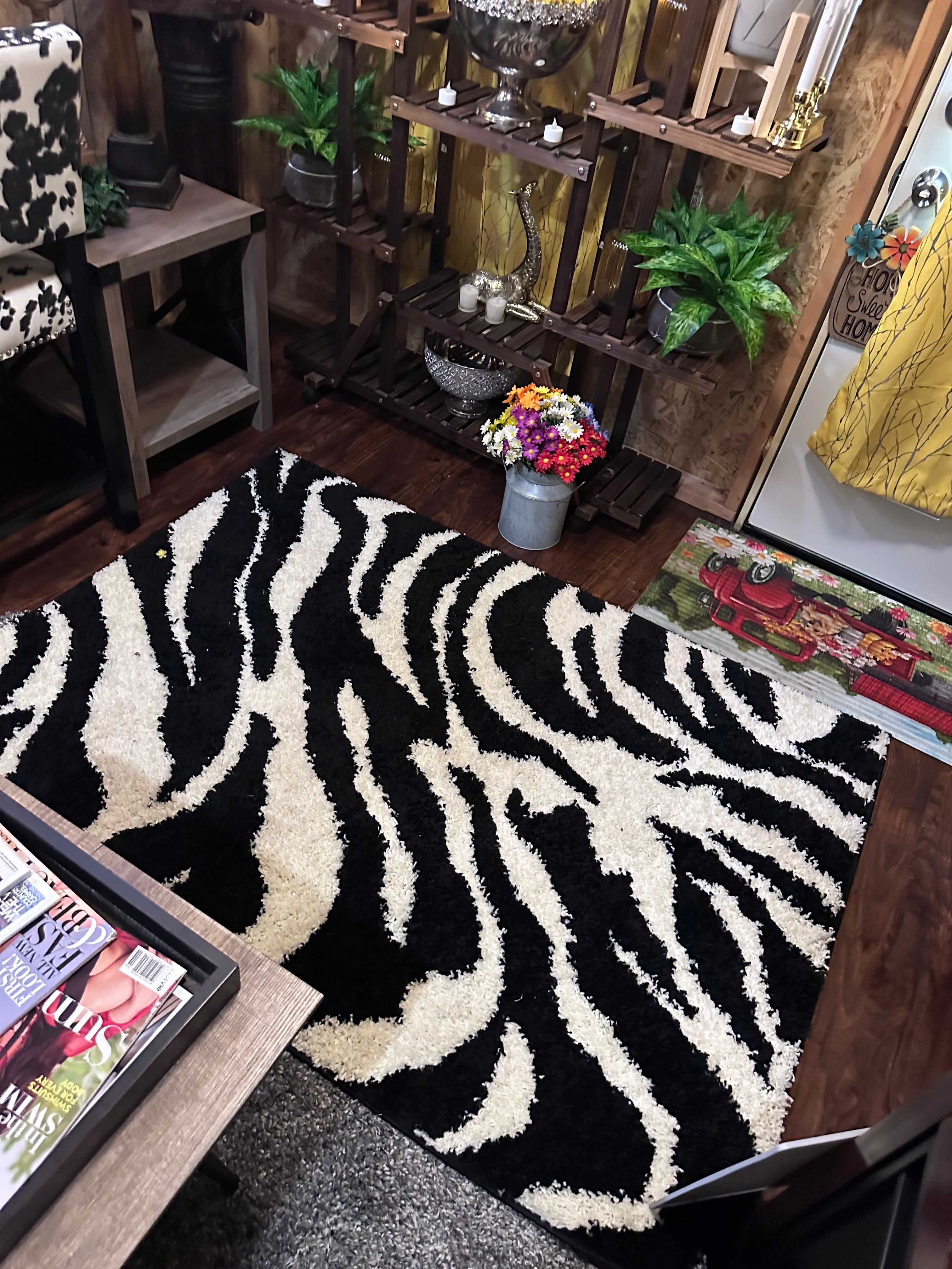Zebra rugs (2) sold as set $40- in store pick up only