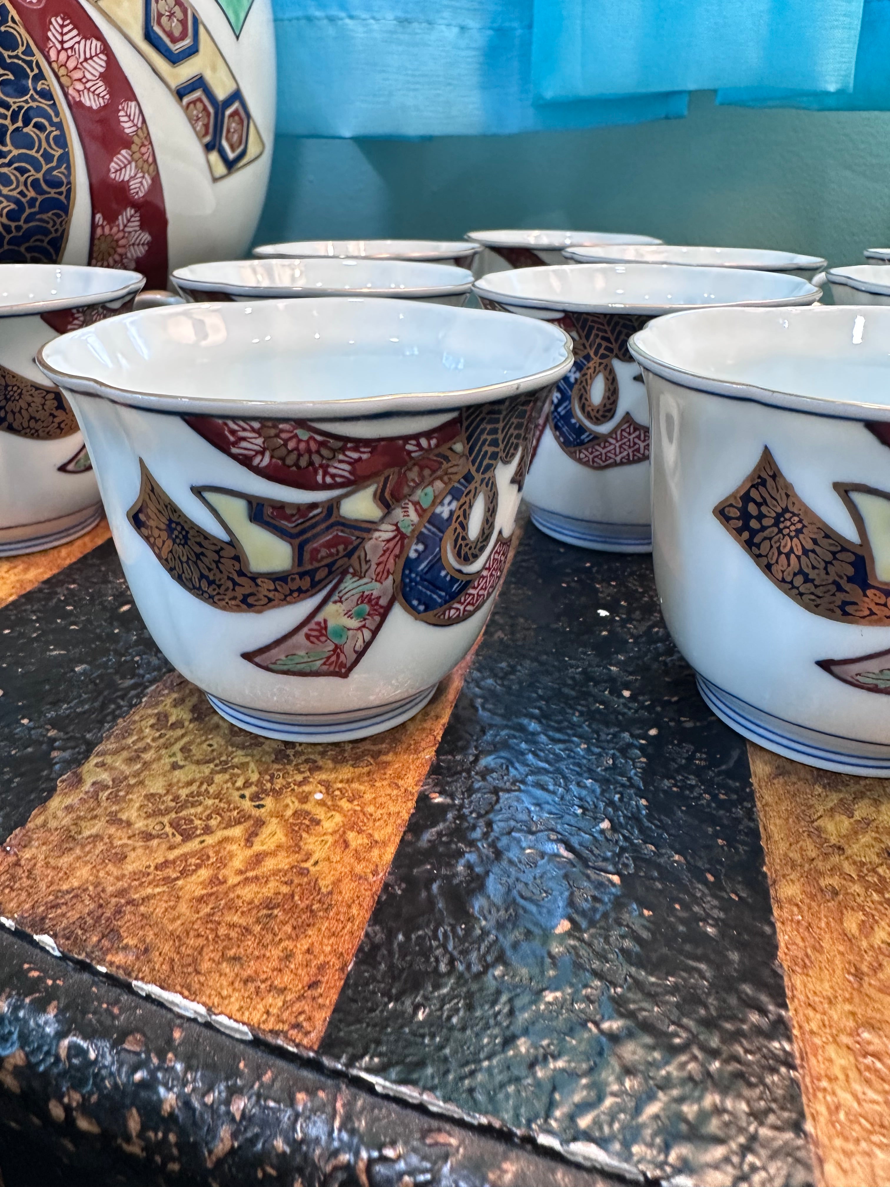Gold Imari set 12 cups and 1 large bowl. $65 in store pick up