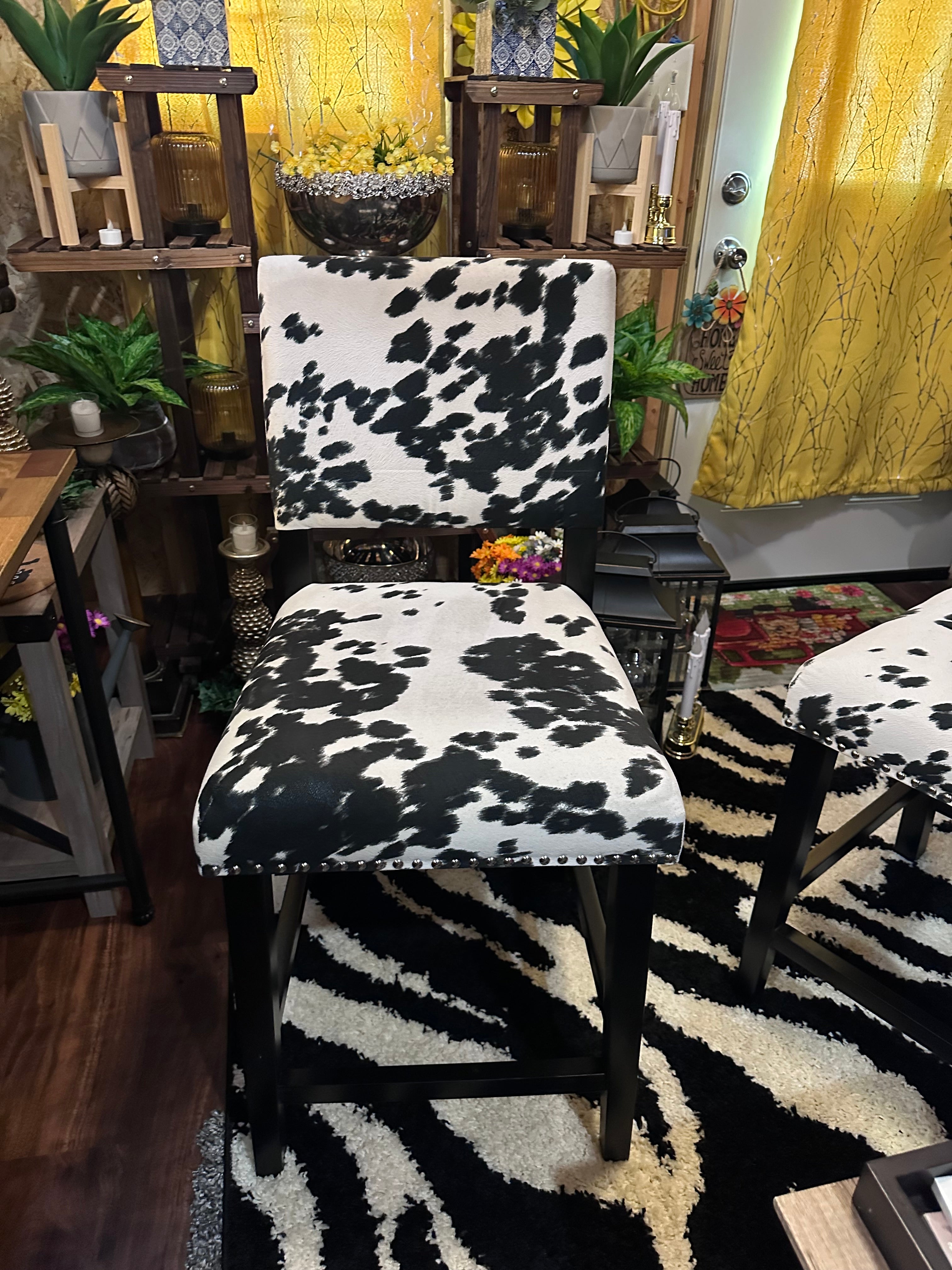 Cow chairs (2) excellent condition sold as a set- in store pick up only