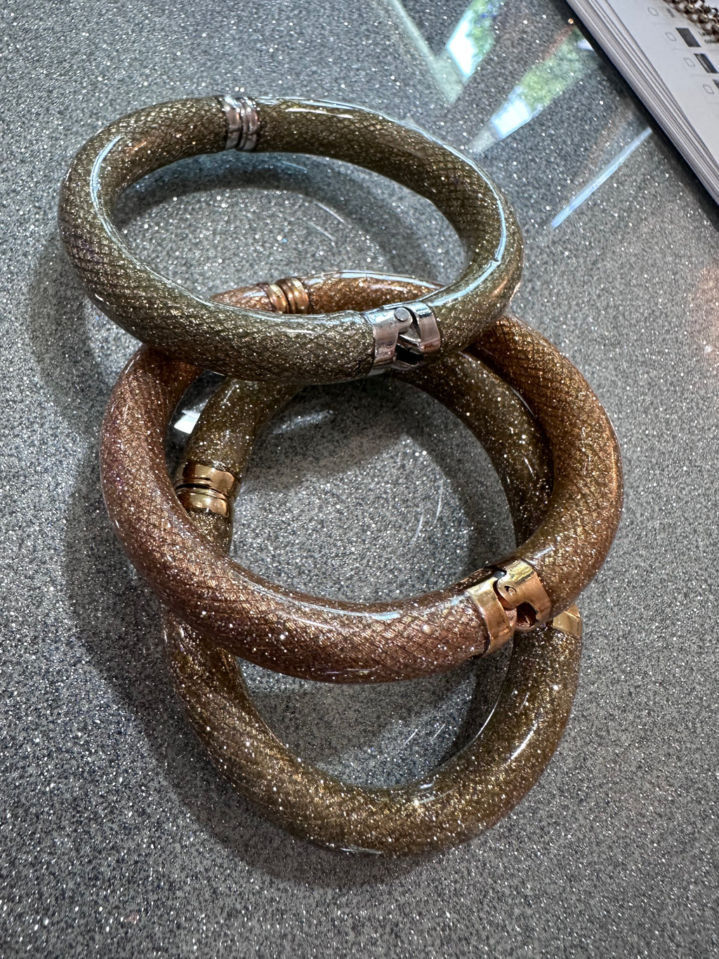 Three glitter bracelets