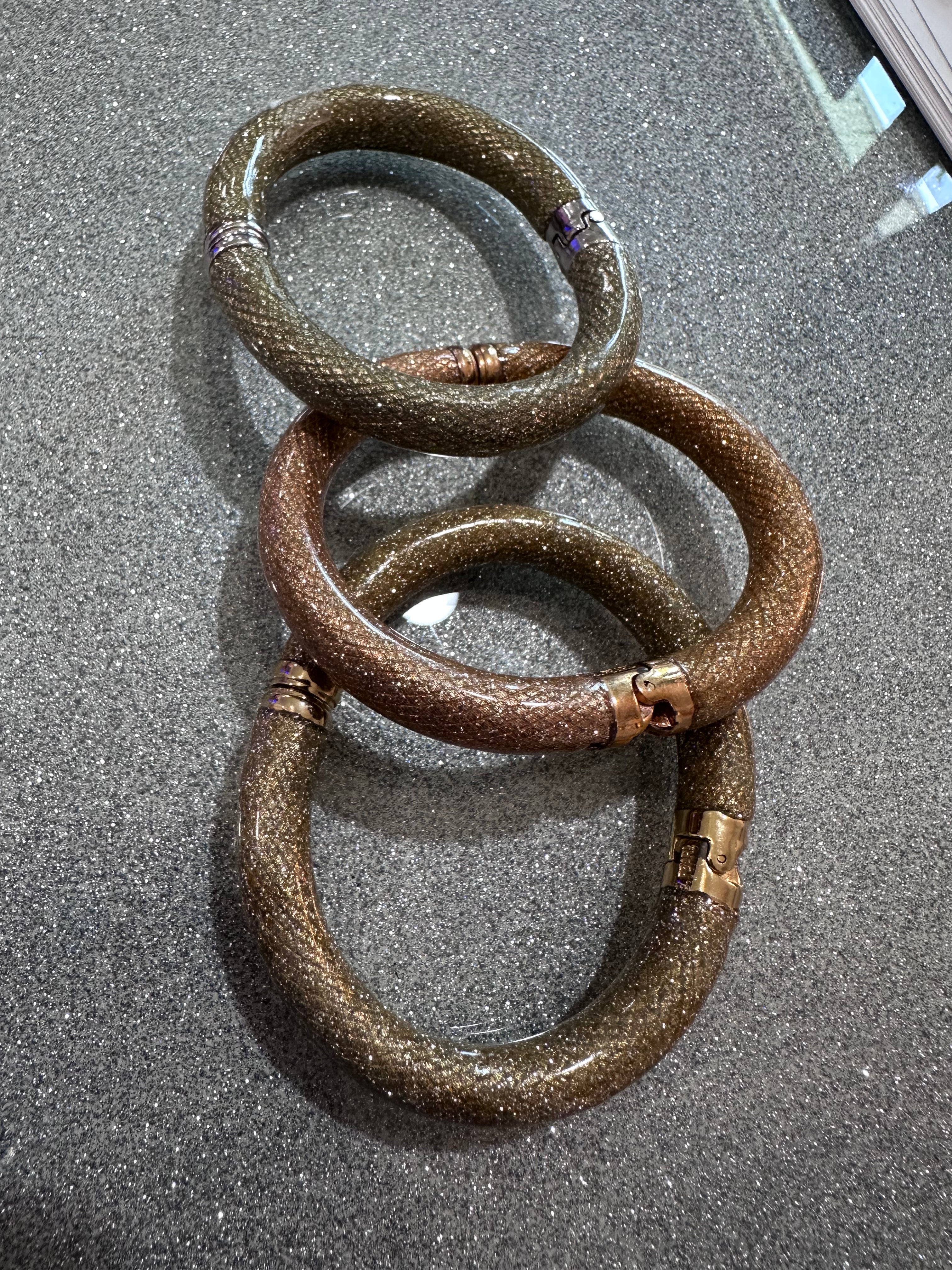 Three glitter bracelets