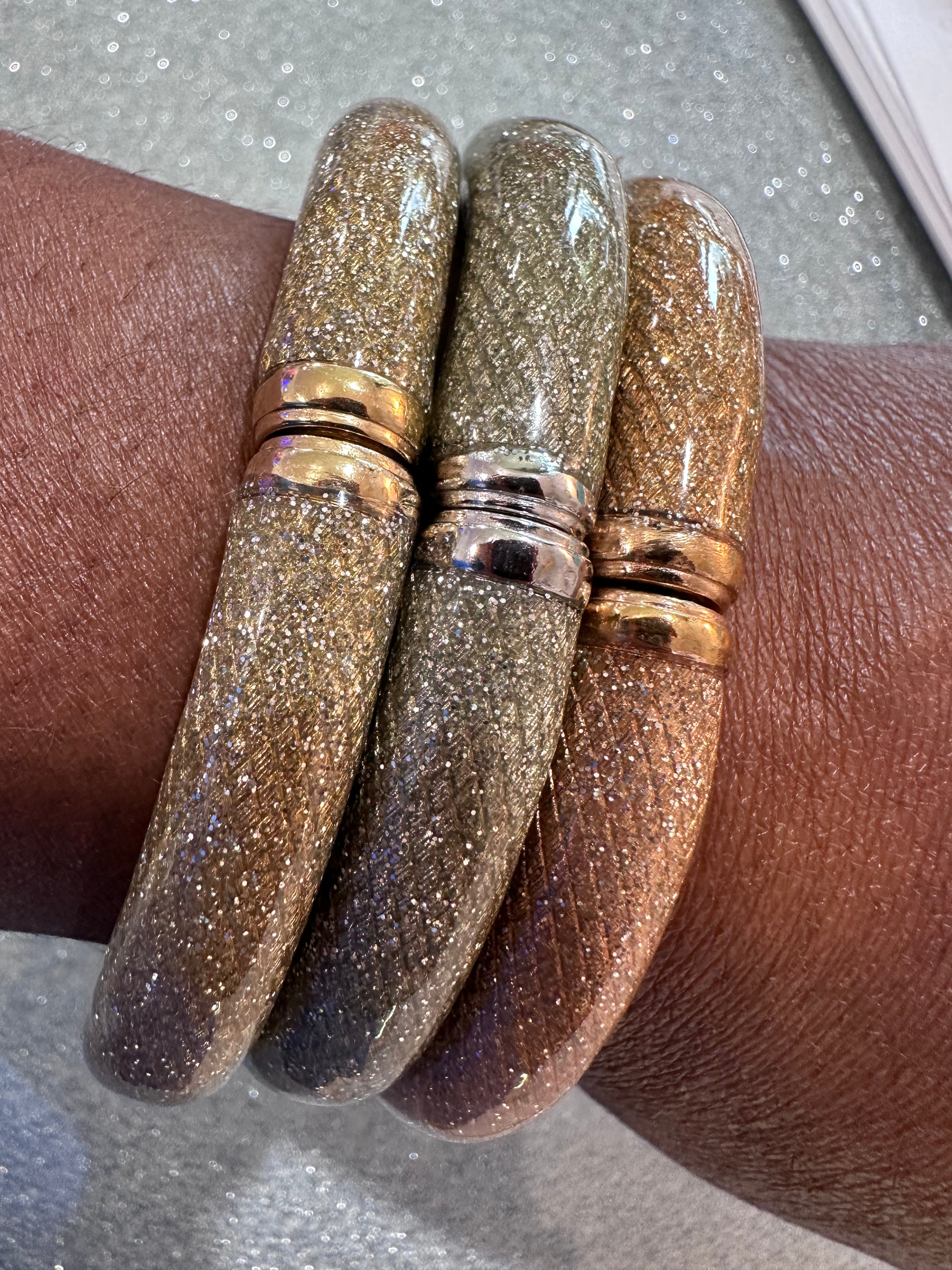 Three glitter bracelets